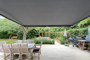 Outward view of awning extended at rear of house