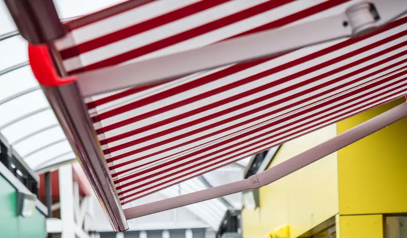 Red and White striped sun awning on shop front