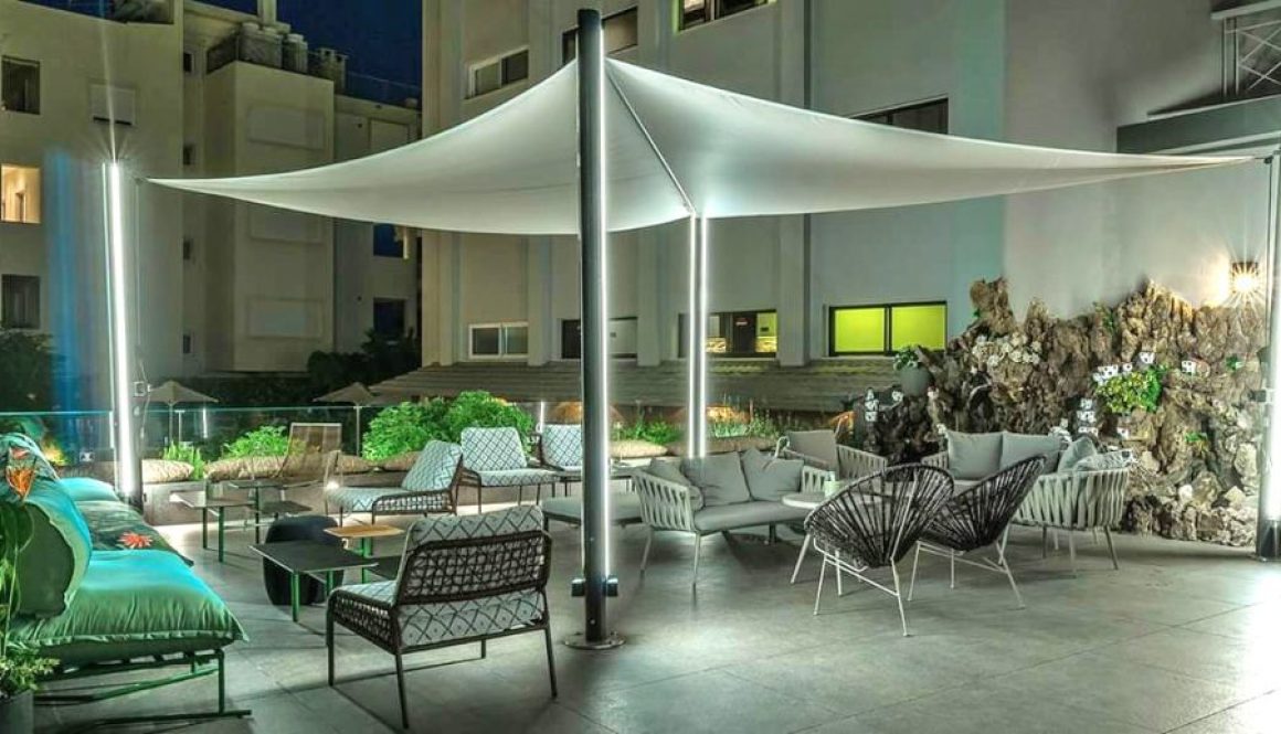 Sail Shades in outdoor commercial dining setting with LED lighting